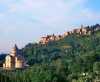 Montepulciano in der nahen Toskana mit San Biagio im Vordergrund <br>© Wikimedia Commons